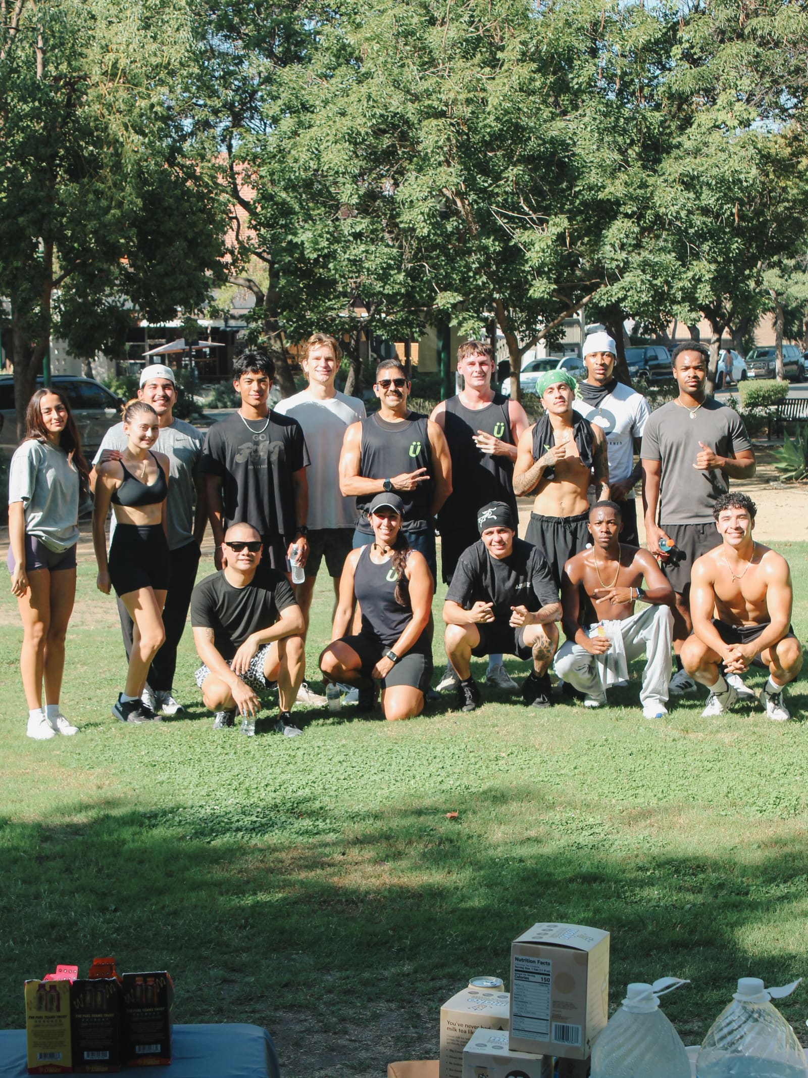 Group shot of the crew posing on the grass at Shelton Park in Claremont